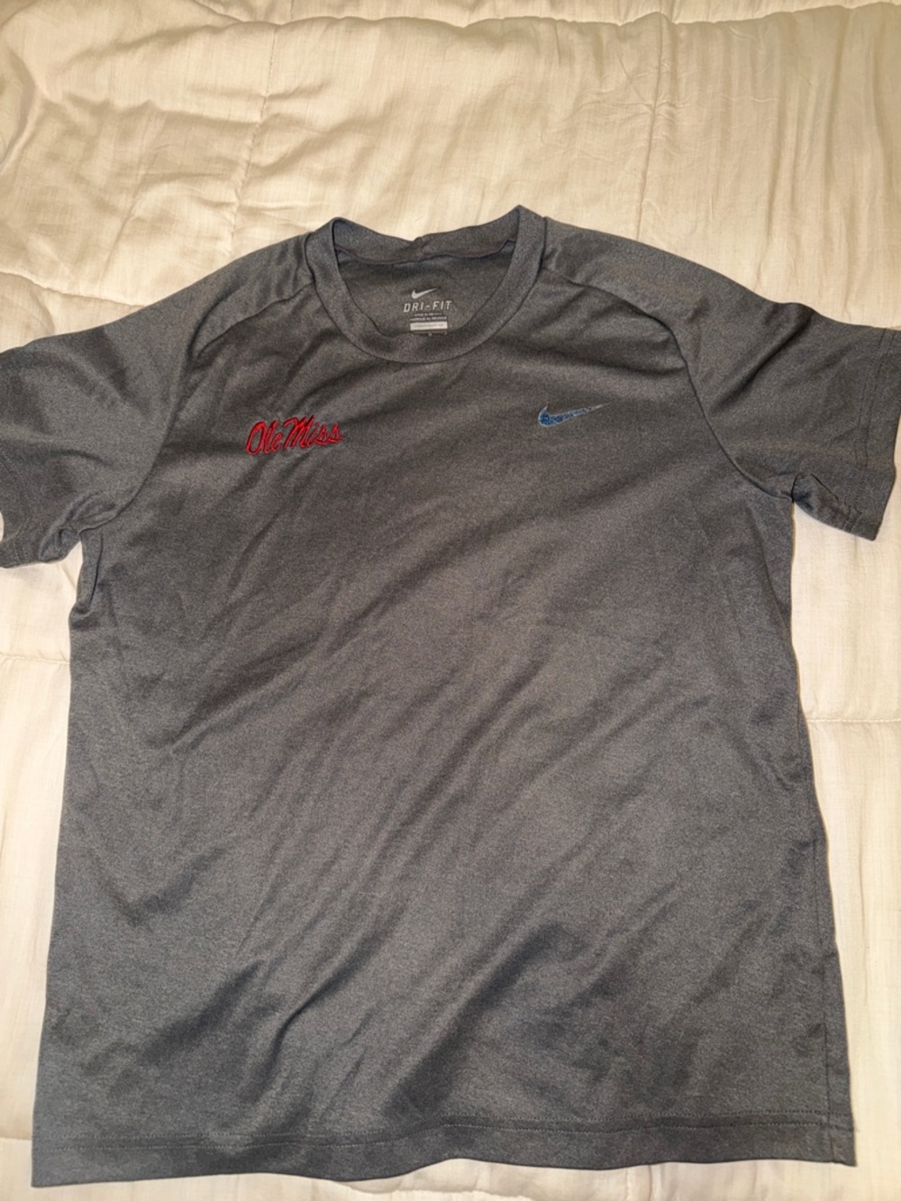 Nike Women’s Dark Gray Short Sleeve Tee with Blue Swoosh and Red Ole Miss Script